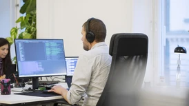 One of Epinova's developers who sits at the computer and works