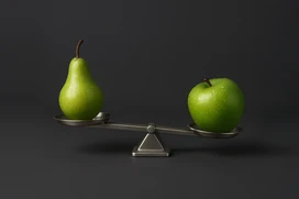 Illustration med ett äpple och ett päron på en våg