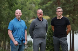 Joacim, Erik and Kalle outdoors with trees and water in the background