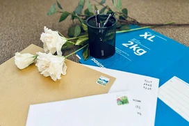 Letters and parcels on a tabel with flowers